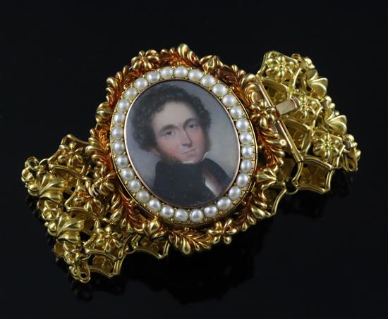A Victorian gold (tested as 18ct) pierced link mourning bracelet, with inset oval oil on ivory portrait miniature of a gentleman